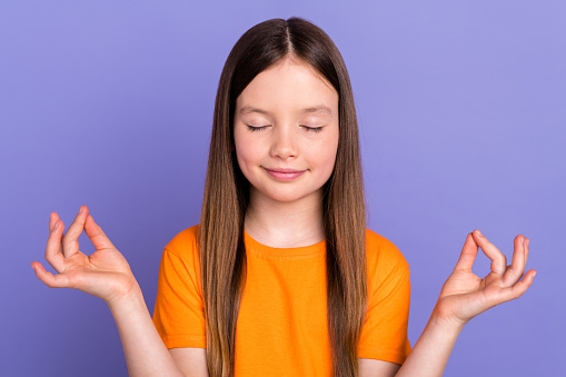 Portrait of studying chill balance relaxation young schoolgirl closed eyes meditation yoga fingers sign isolated on violet color background.