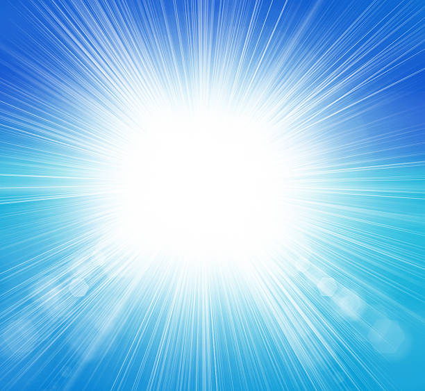 Sun on blue sky with lenses flare