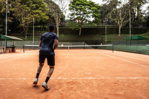istock Young man playing tennis 1759501305