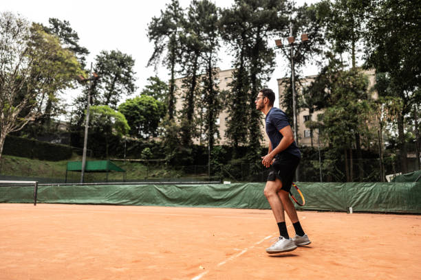 istock Young man playing tennis 1759501325