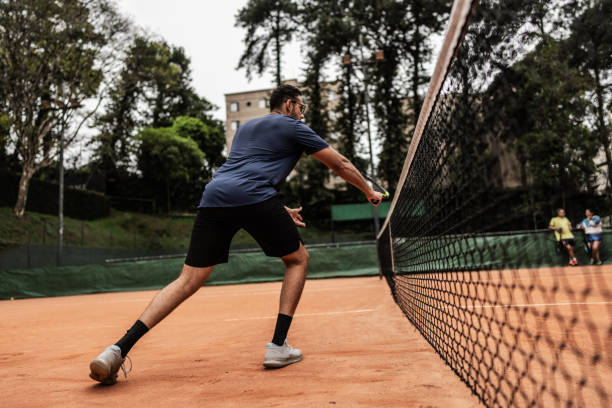 istock Young man playing tennis 1759501942
