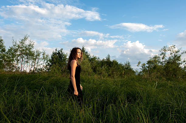 istock Beautiful girl walks in high grass 175950776