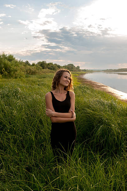 istock Beautiful girl walks in high grass 175950811