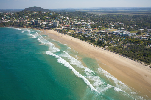 Drone view of Palm Beach and Barrenjoey Head Lighthouse, an affluent beachside suburb in the Northern Beaches region of Sydney, New South Wales, Australia. Seen from Great Mackerel Beach (foreground).