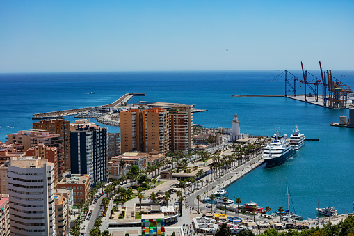 Panorama from castle hill on Malaga port park, Pedro Luis Alonso gardens, Paseo del Parque street and town hall, Spain