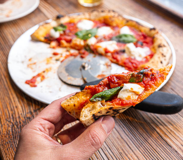 istock Neapolitan Margherita Pizza on a rustic wooden table 1759536682