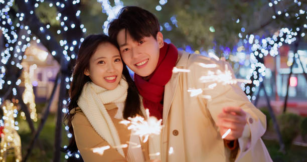 istock couple play sparkler together 1759538349