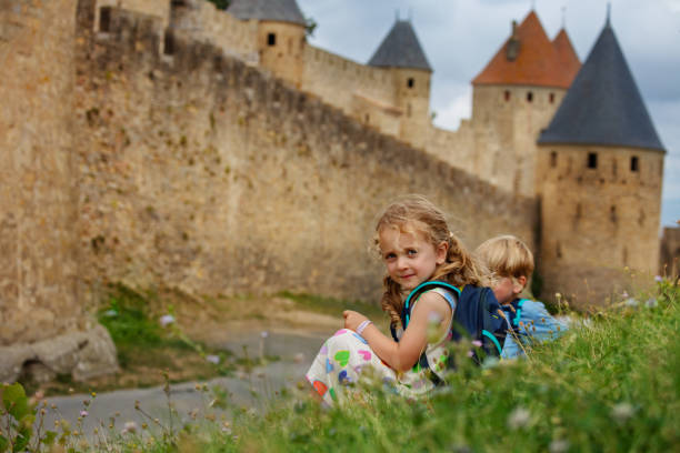 istock Children sightsee Carcassonne medieval site during vacation 1759556798
