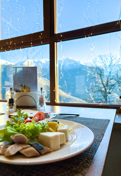 istock delicious breakfast at the hotel overlooking a mountain range with snow-capped hills 1759557042