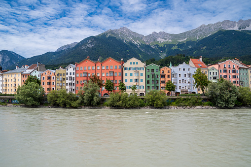 Colorful buildings at the waterfront of the Inn river in Innsbruck in Austria