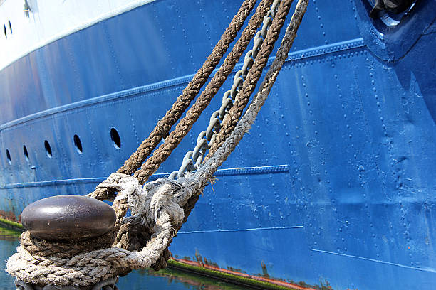istock Moored old ship with chain and ropes in the port 175956262