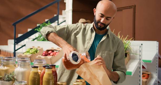istock Shopper buying grains from local seller 1759569067