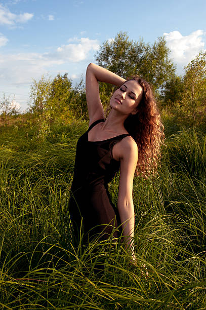 istock Beautiful girl walks in high grass 175957078