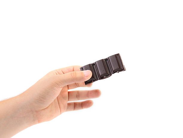 istock Hand holds dark chocolate bar. 175958696