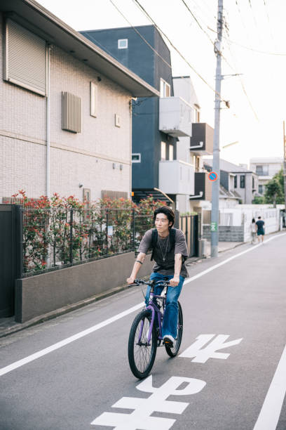 istock Young man is riding his bicycle in city 1759592242