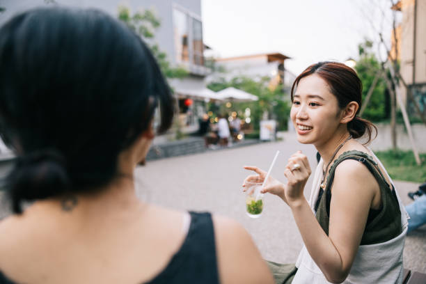 istock Two female friends having a refreshing drink at cafe 1759592776