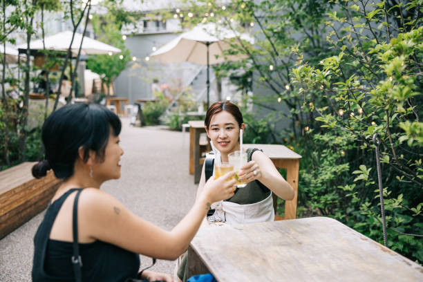 istock Two female friends having a refreshing drink at cafe 1759593301