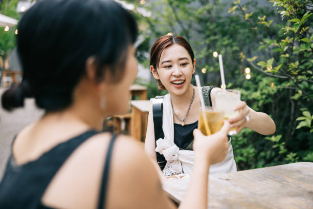 istock Two female friends having a refreshing drink at cafe 1759593671
