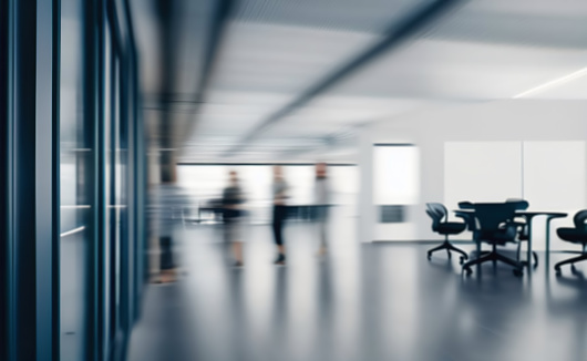 Blurred image of a spacious bright modern office.