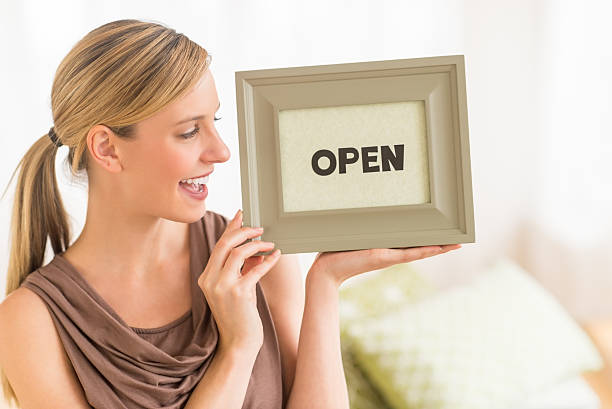 istock Female Owner Holding Open Sign In Bedding Store 175959864