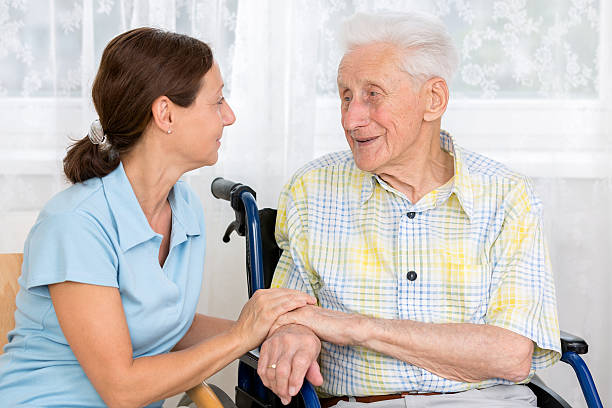 istock Senior Man with caregiver 175959890