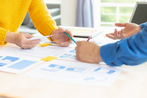 istock The designer team is designing the uxui system to make the uxui system work well on new phones and support system updates. Website development concept UI UX front end designer 1759611740