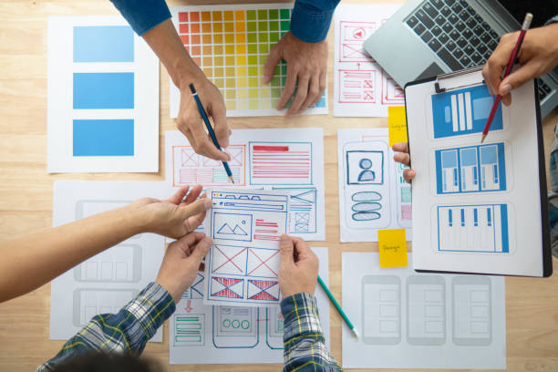 istock The designer team is designing the uxui system to make the uxui system work well on new phones and support system updates. Website development concept UI UX front end designer 1759617232