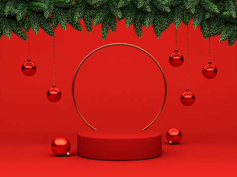 Red christmas background with christmas ornaments and pine branches