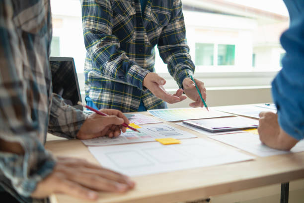 istock The designer team is designing the uxui system to make the uxui system work well on new phones and support system updates. Website development concept UI UX front end designer 1759622239