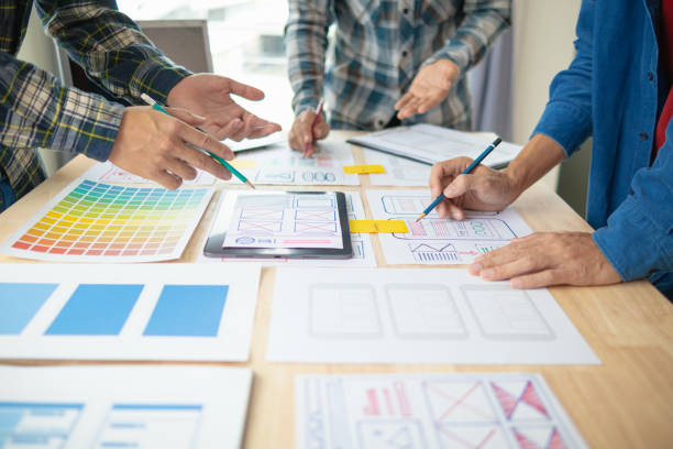 istock The designer team is designing the uxui system to make the uxui system work well on new phones and support system updates. Website development concept UI UX front end designer 1759622241