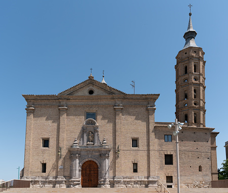 The Church of San Juan de los Panetes was built in 1725 in Zaragoza, Spain. The Torreon de la Zuda (Tower of the Zuda) is to the left of the church.