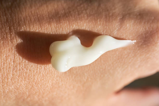 istock A smear of white moisturizer or sunscreen on a woman's hand. 1759623395