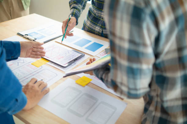 istock The designer team is designing the uxui system to make the uxui system work well on new phones and support system updates. Website development concept UI UX front end designer 1759623919