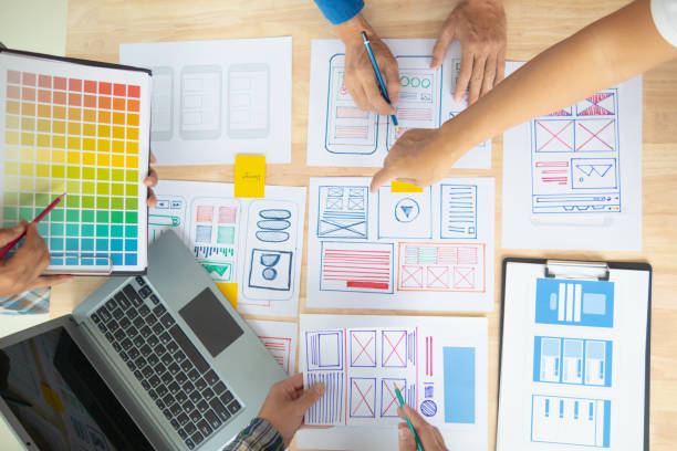 istock The designer team is designing the uxui system to make the uxui system work well on new phones and support system updates. Website development concept UI UX front end designer 1759625056