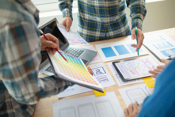 istock The designer team is designing the uxui system to make the uxui system work well on new phones and support system updates. Website development concept UI UX front end designer 1759625117