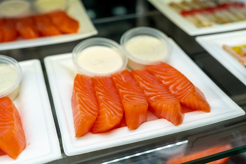 Thinly sliced fresh salmon arranged