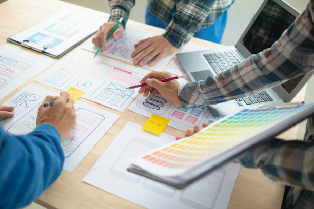 istock The designer team is designing the uxui system to make the uxui system work well on new phones and support system updates. Website development concept UI UX front end designer 1759627836