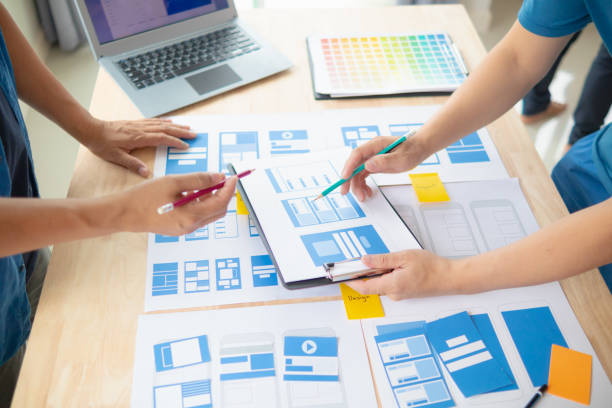istock The designer team is designing the uxui system to make the uxui system work well on new phones and support system updates. Website development concept UI UX front end designer 1759629944