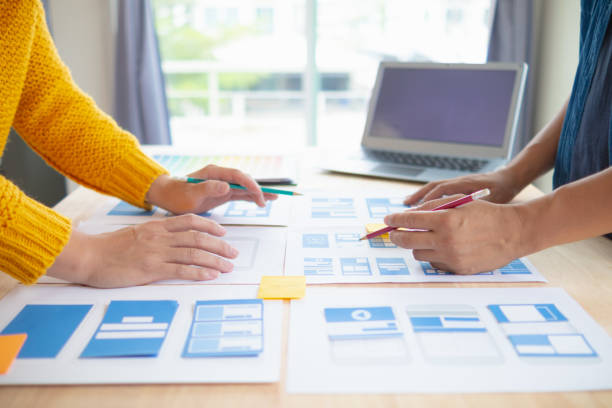 istock The designer team is designing the uxui system to make the uxui system work well on new phones and support system updates. Website development concept UI UX front end designer 1759631037