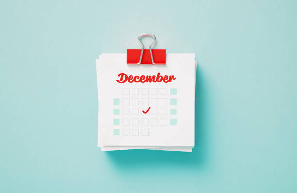 close up of calendar on the green table background, planning for business meeting or travel planning concept