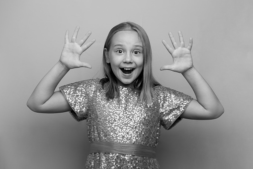 Happy surprised shocked excited child girl, black and white photo