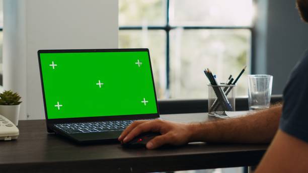 istock Male employee looks at greenscreen 1759667480