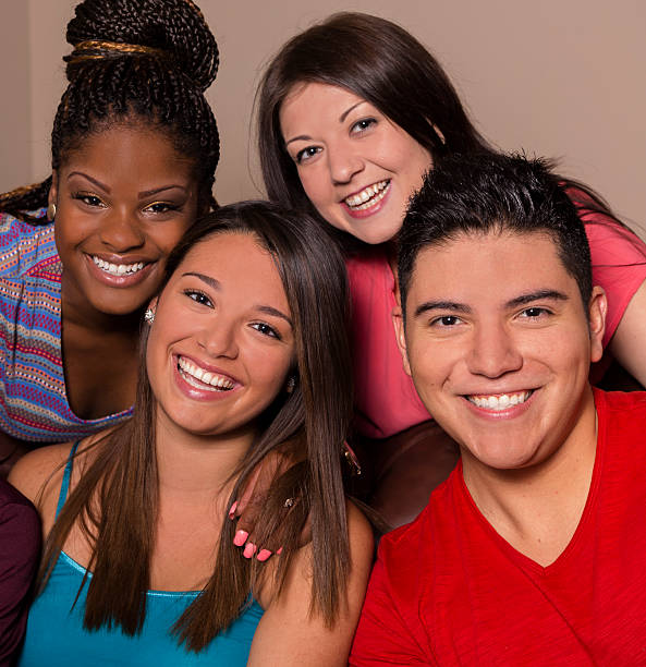 istock Relationships: Four friends smile and laugh together. 175967466