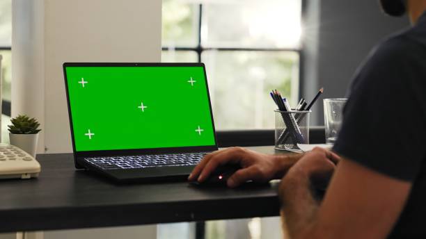istock Male employee looks at greenscreen 1759684910