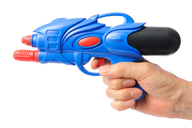 istock Shoot with a blue squirt gun against white background 175970482