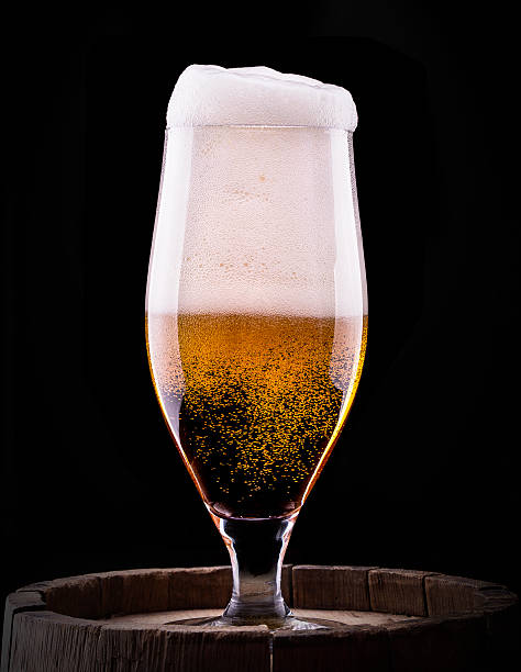 istock Frosty glass of light beer on black background 175970860