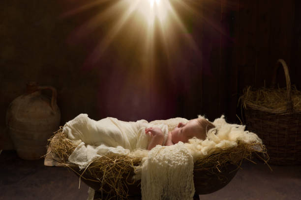 Christmas Light shining Live Christmas nativity scene of 8 days old baby boy sleeping in a manger west bank stock pictures, royalty-free photos & images