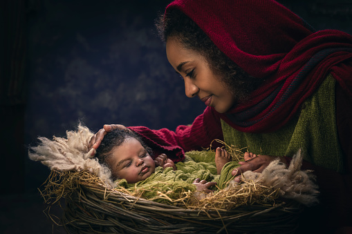 Live reenactment of the Christmas Nativity Scene in an African version with Ethiopian virgin Mary and a black baby doll