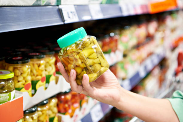 istock Canned peppers in hand 1759720612