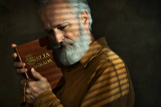 istock Senior man with Holy Bible 1759750639